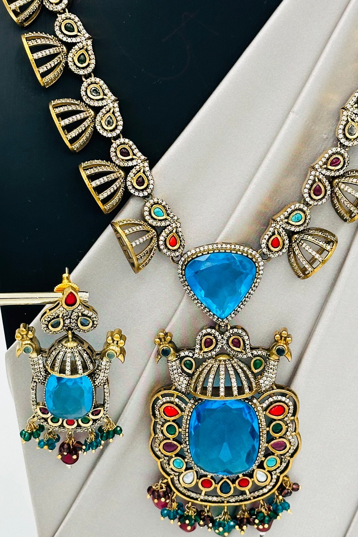 Emerald Eclat: Brass Brilliance in CZ and Gemstone Fusion - swadeshsouq.com