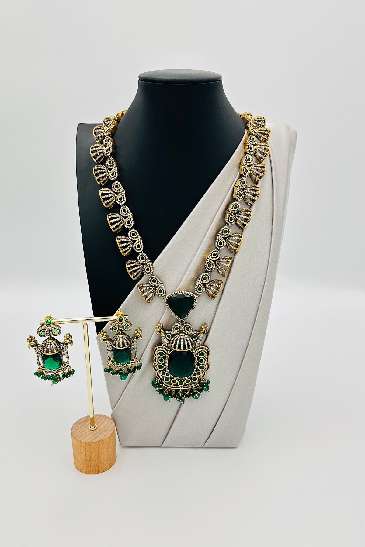 Emerald Eclat: Brass Brilliance in CZ and Gemstone Fusion - swadeshsouq.com