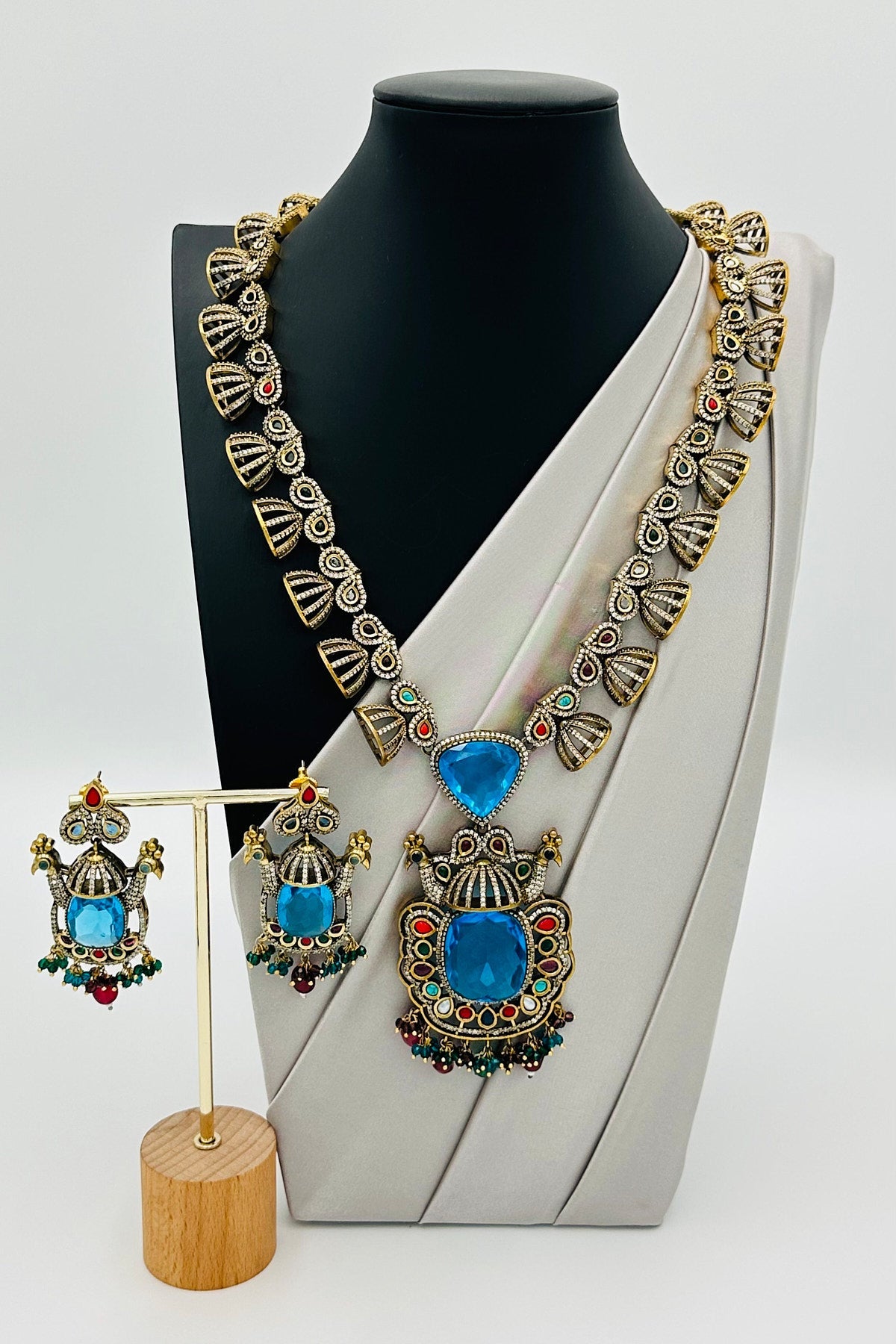 Emerald Eclat: Brass Brilliance in CZ and Gemstone Fusion - swadeshsouq.com