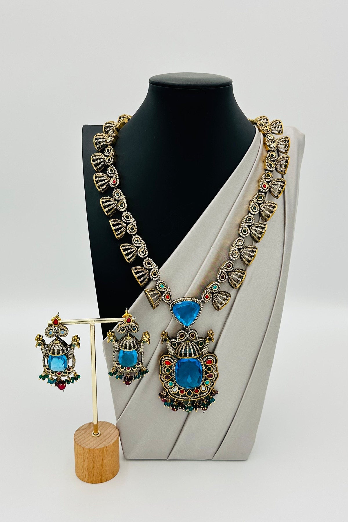 Emerald Eclat: Brass Brilliance in CZ and Gemstone Fusion - swadeshsouq.com