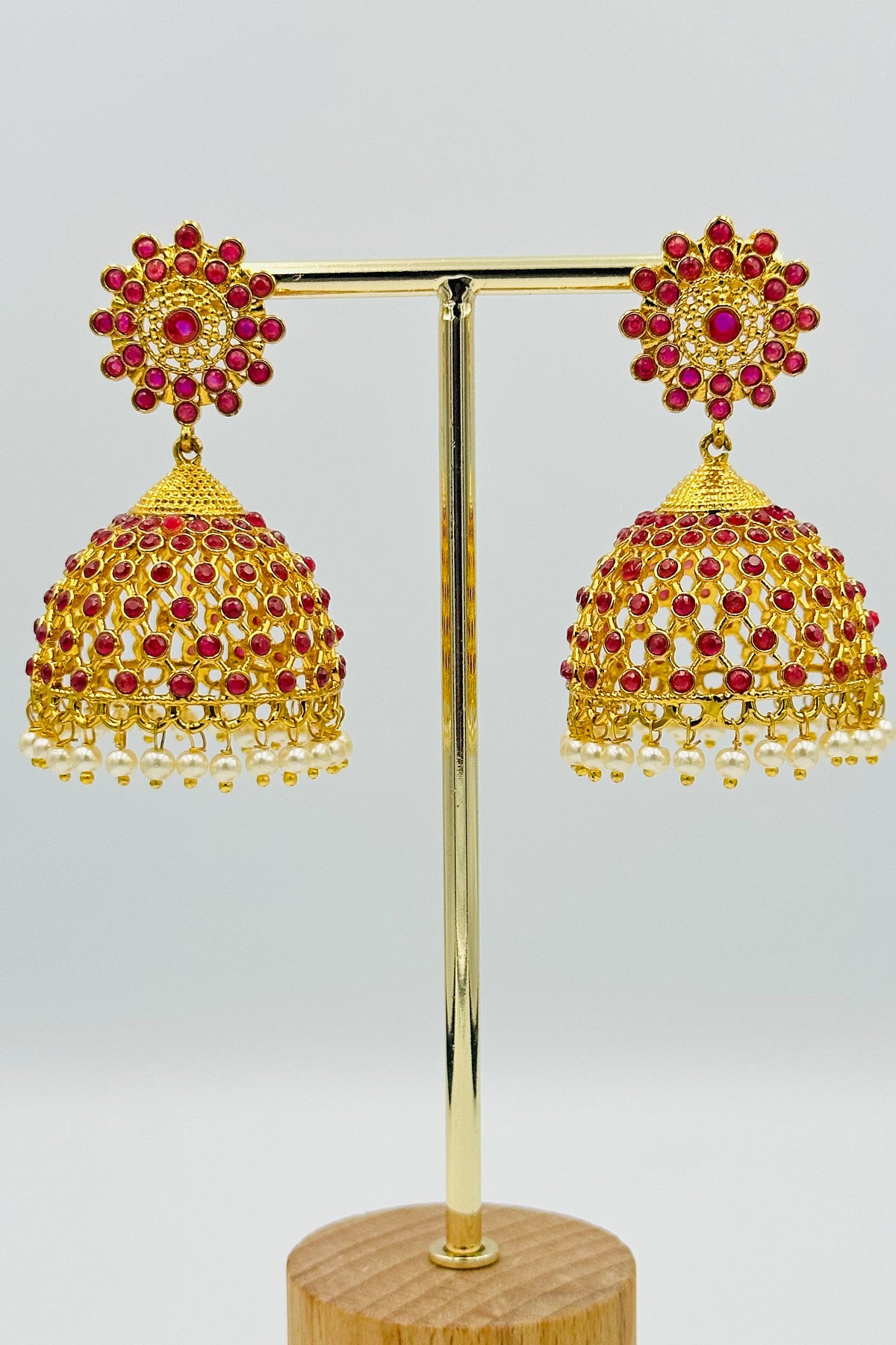 Jaal Pattern Jhumka Earrings with Stones and Pearls