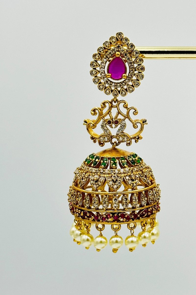 Royal Gold - Plated Jhumkas with Pink Stone, CZ, and Pearl Detailing - swadeshsouq.com