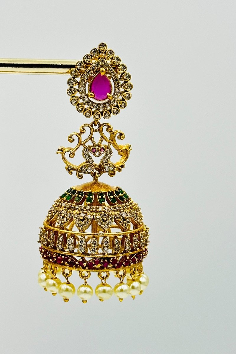 Royal Gold - Plated Jhumkas with Pink Stone, CZ, and Pearl Detailing - swadeshsouq.com