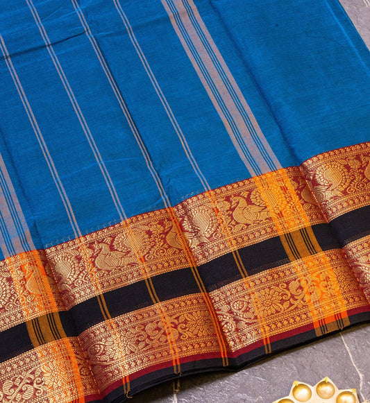 Upgrade Ethnic Wardrobe with Ajanta Blue Chettinad Saree, Bold Black & Red Zari Border. Shop now on swadeshsouq.com.