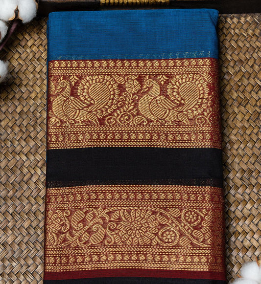 Upgrade Ethnic Wardrobe with Ajanta Blue Chettinad Saree, Bold Black & Red Zari Border. Shop now on swadeshsouq.com.