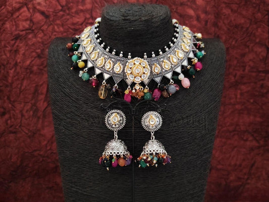 Elevate your look with Oxidized Silver Necklace w/ Intricately Designed Pearl & Multicolor Accents from swadeshsouq.com.