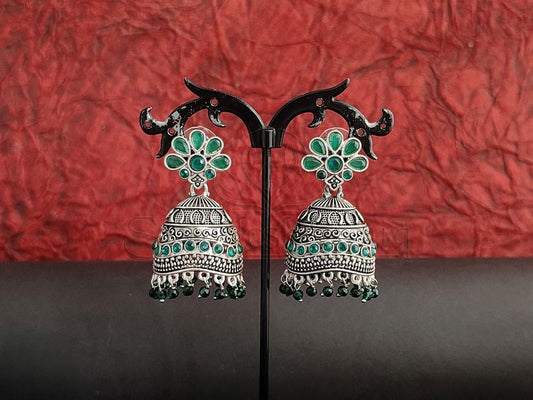 Emerald Embossed Oxidised Silver Jhumkas with Fluid Green Beads. - swadeshsouq.com