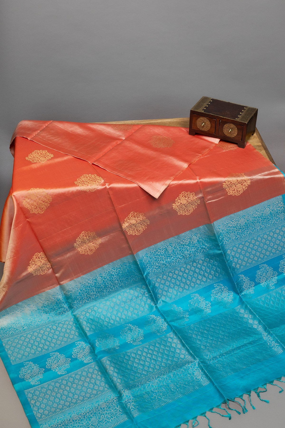 Light peach and sky blue Kanjeevaram silk saree with intricate designs, available online at Swadeshsouq.com in UAE.