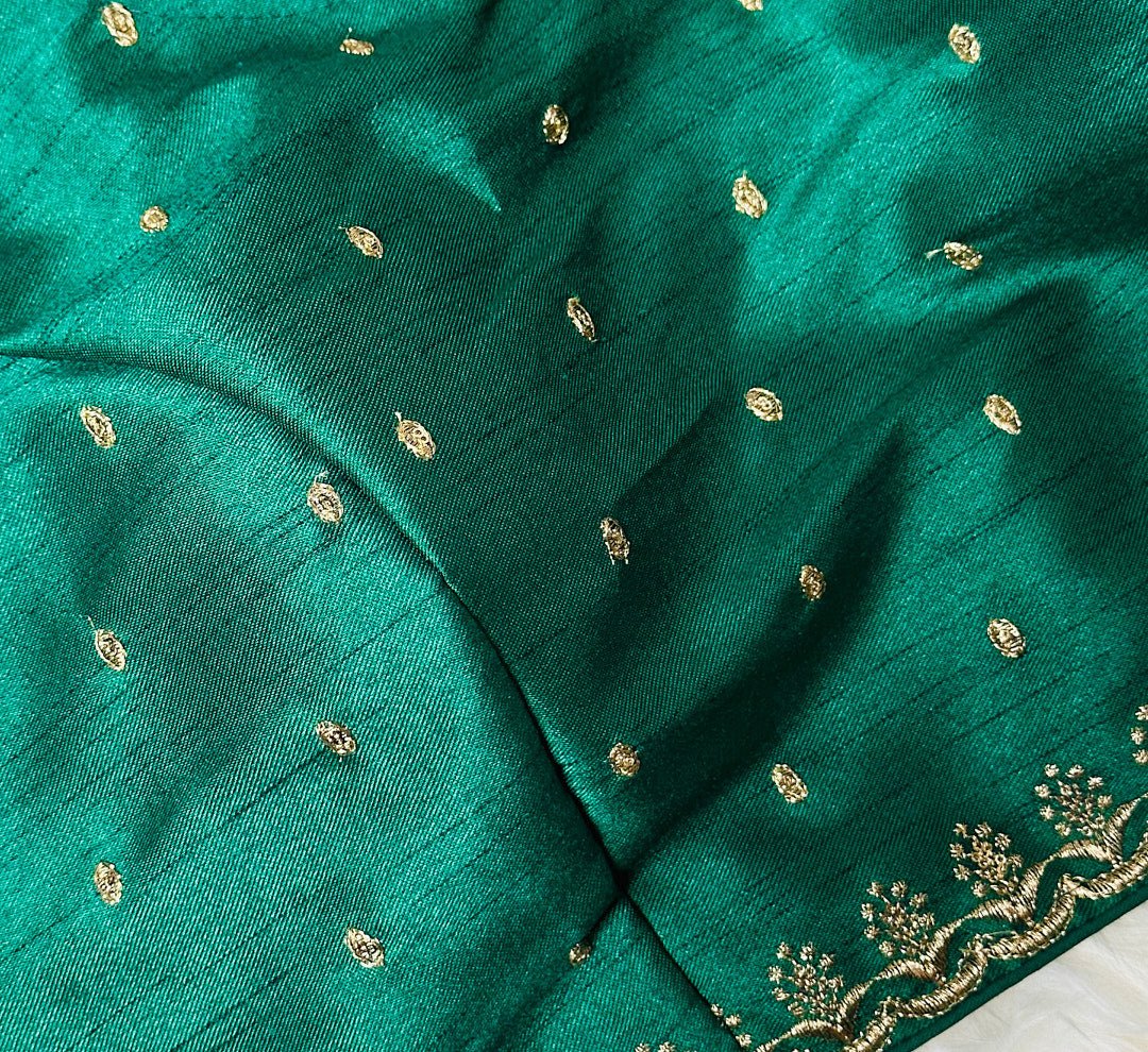 Enchanting Jaipuri Charm: Adorn Yourself with the Green Raw Silk Blouse with Golden Buttis. - swadeshsouq.com