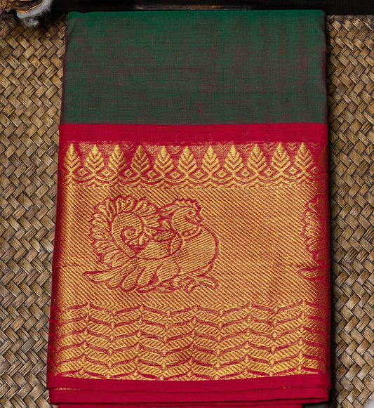 Embrace ethereal beauty with Green & Pink Dual-Toned Chettinad Cotton Saree w/ Red Zari Border from swadeshsouq.com.