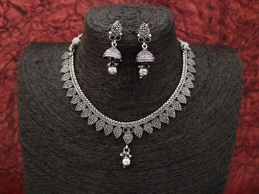 Exquisite Oxidized Silver Necklace with Intricate Design and Emerald Accents, Paired with Matching Jhumkas. - swadeshsouq.com