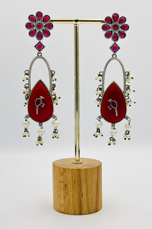 Handcrafted Silver Earrings with Deep Red Crystal Accents and Bird Embellishment - swadeshsouq.com