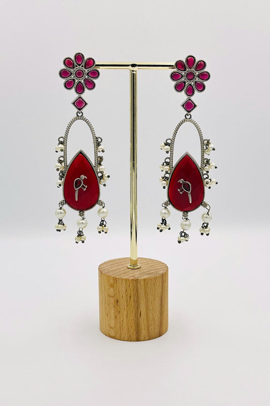 Handcrafted Silver Earrings with Deep Red Crystal Accents and Bird Embellishment - swadeshsouq.com