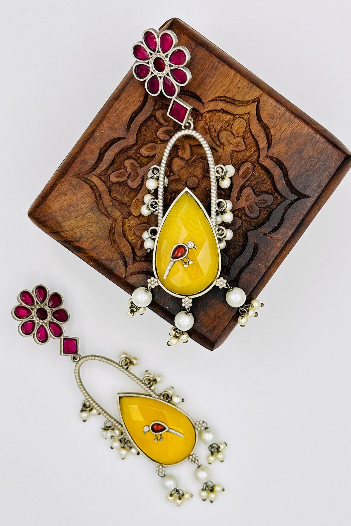 Handcrafted Silver Earrings with Red and Yellow Crystal Accents and Bird Embellishment - swadeshsouq.com