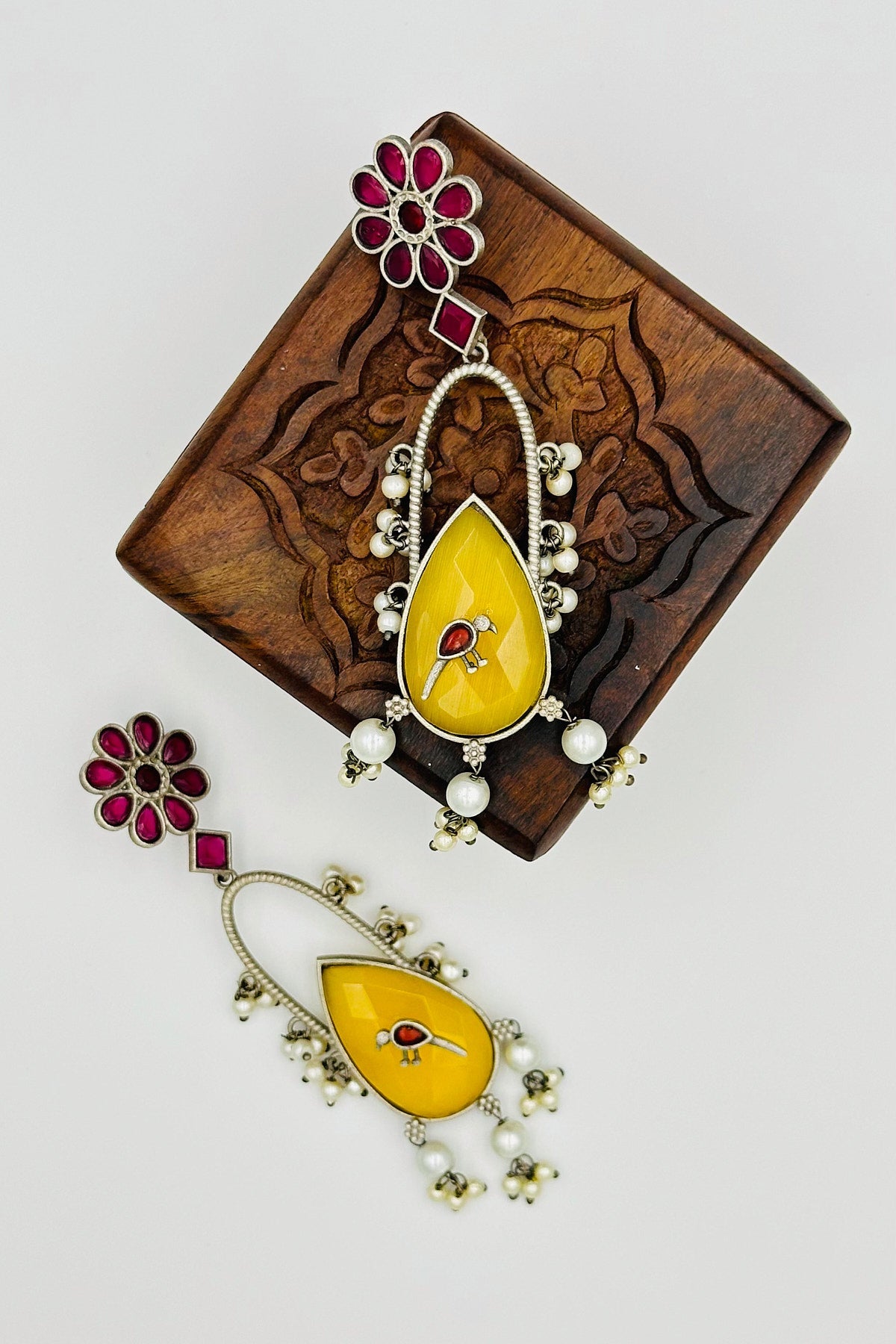 Handcrafted Silver Earrings with Red and Yellow Crystal Accents and Bird Embellishment - swadeshsouq.com