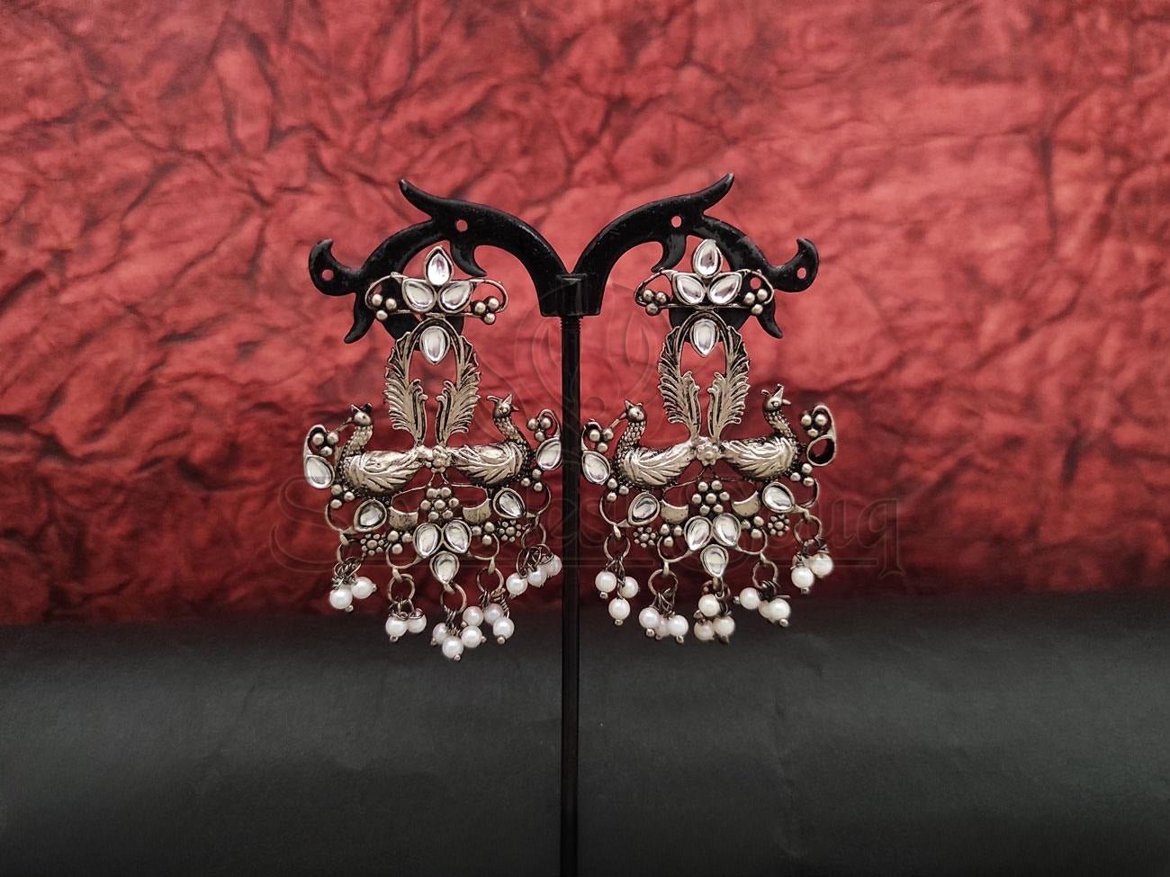 Intricately Designed Oxidised Silver Danglers Embossed with Kundans and Pearls. - swadeshsouq.com