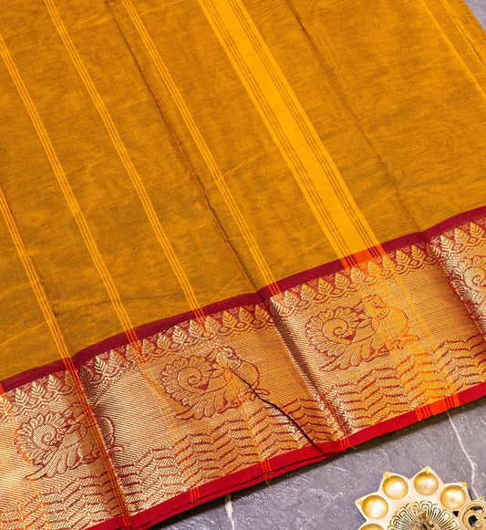 Majestic Peacock Splendor: Dark Mustard Yellow and Maroon Zari Border Saree with Peacock Design. - swadeshsouq.com