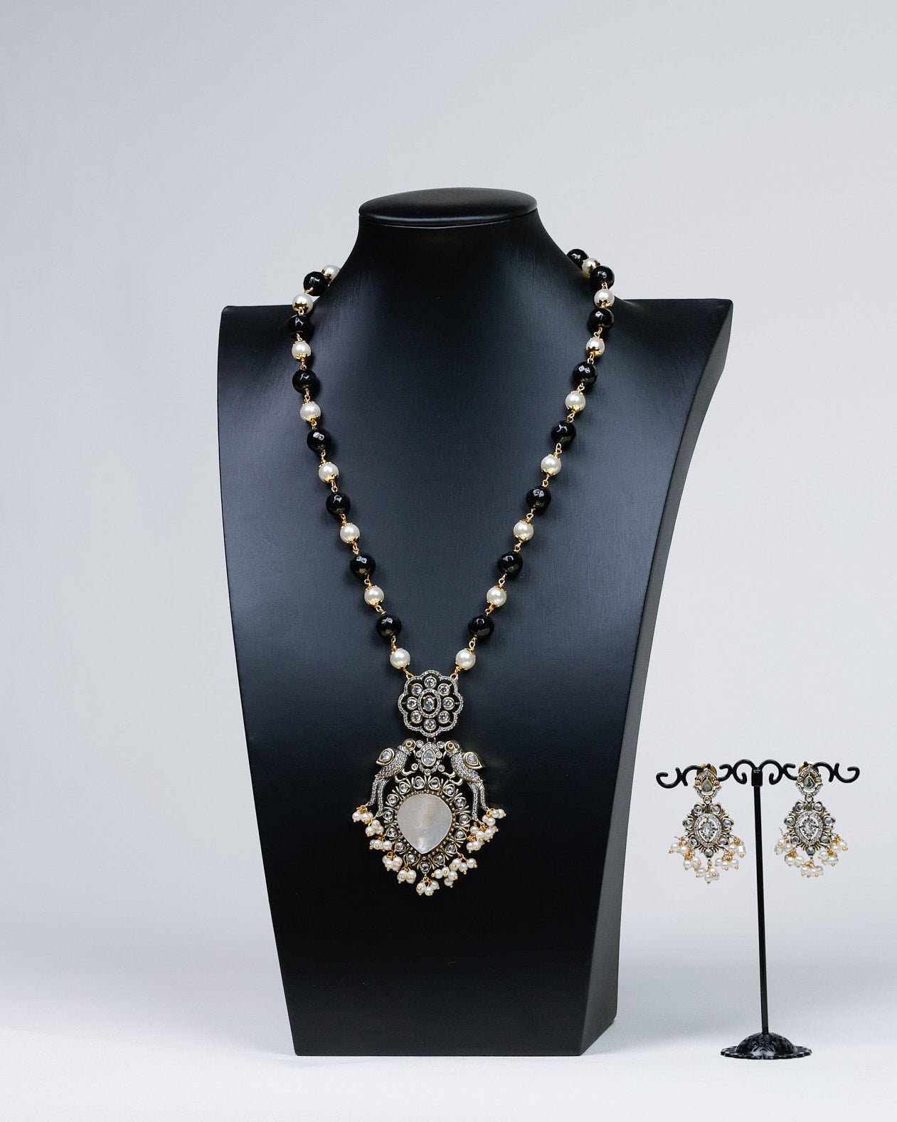 Noir Allure: Parrot-Adorned Black Crystal & Pearl Ensemble - swadeshsouq.com