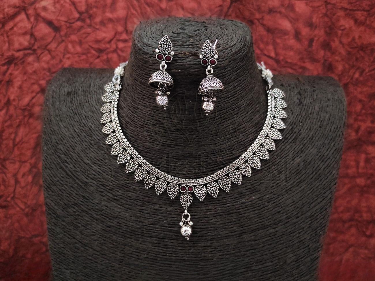 Oxidized Silver Necklace with Delicate Design and Ruby Embellishments Paired with Matching Jhumkas. - swadeshsouq.com