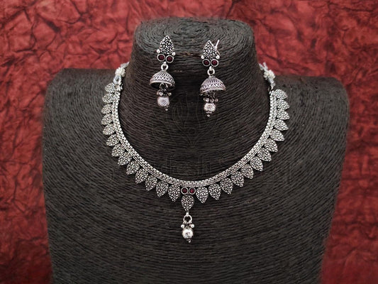 Oxidized Silver Necklace with Delicate Design and Ruby Embellishments Paired with Matching Jhumkas. - swadeshsouq.com