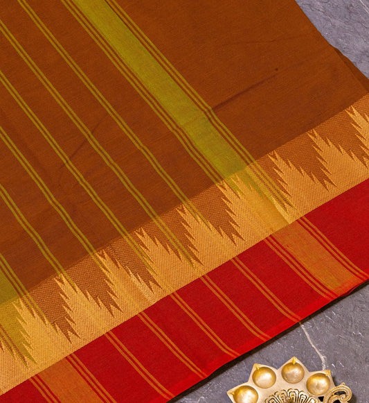 Embrace Radiant & Timeless Dark Mustard Green & Red Temple Border Chettinad Cotton Saree from swadeshsouq.com.