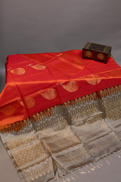 RADIANT ELEGANCE: THE BRIGHT ORANGE AND GREY KANJEEVARAM SILK SAREE - swadeshsouq.com