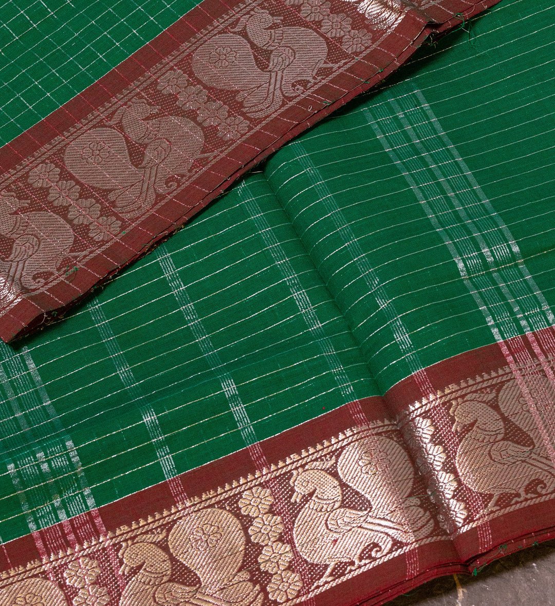 Regal Beauty: Adorn Yourself with the Green and Maroon Sungudi Saree with Silver Zari Embellishments. - swadeshsouq.com