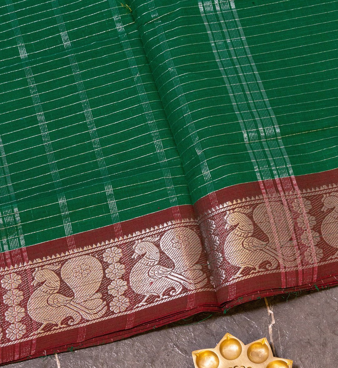 Regal Beauty: Adorn Yourself with the Green and Maroon Sungudi Saree with Silver Zari Embellishments. - swadeshsouq.com