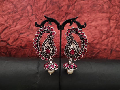 Ruby and Emerald Embellished Oxidised Silver Earrings with Jhumka and Pearl Detail. - swadeshsouq.com