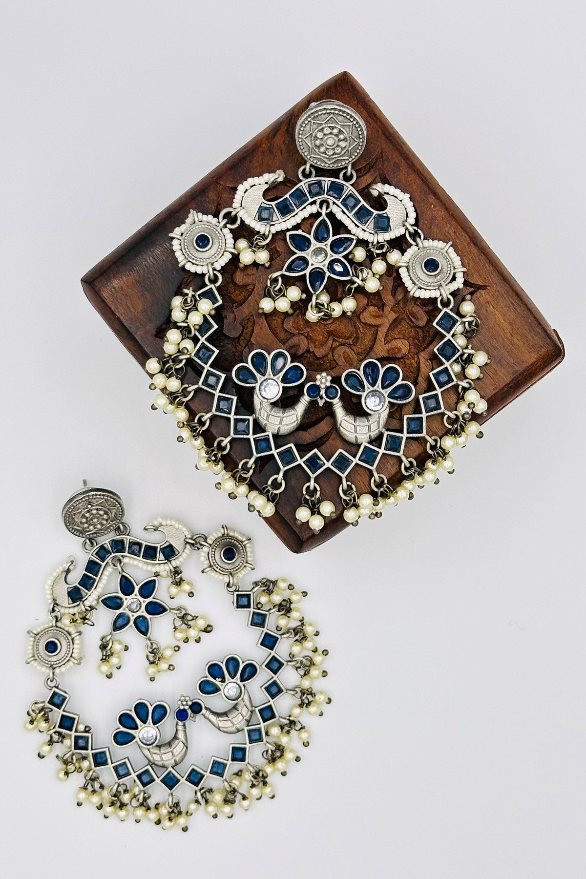 Silver Peacock Chandbali Earrings with Pearls and Deep Blue Stones - swadeshsouq.com