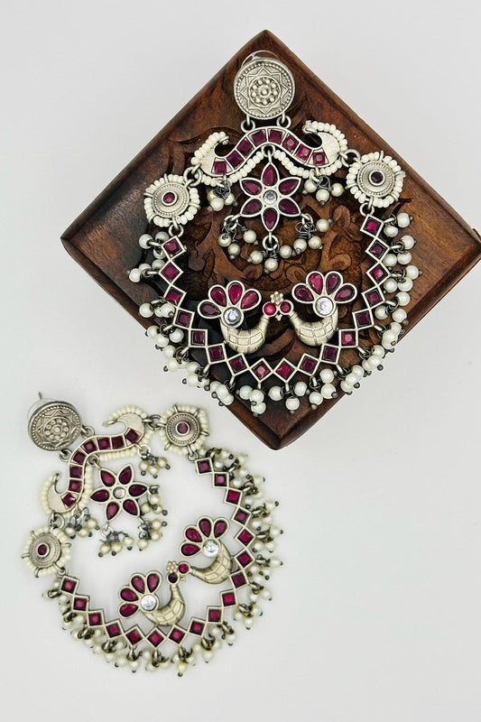 Silver Peacock Chandbali Earrings with Pearls and Deep Red Stones - swadeshsouq.com