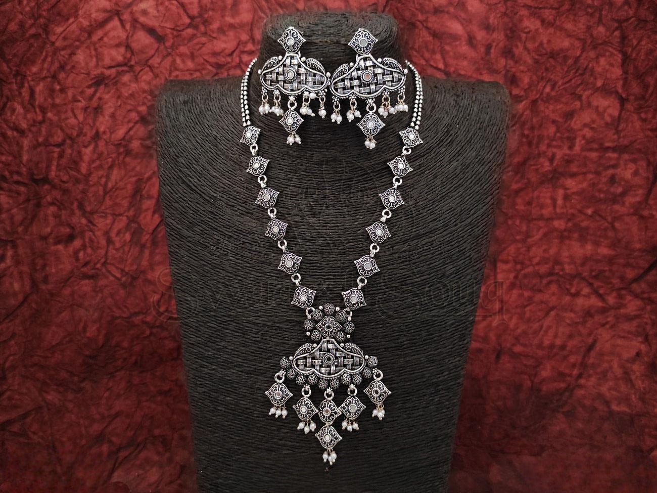 Stunning Sophistication: Oxidized Silver Long Chain with White Stone Danglers and Pearl Tassels. - swadeshsouq.com