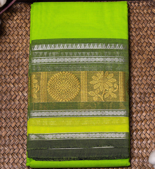 Embrace the beauty of vibrant Fluorescent & Olive Green Chettinad Cotton Saree w/ Silver Zari design from swadeshsouq.com.