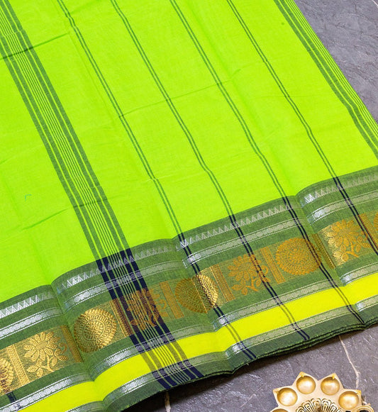 Embrace the beauty of vibrant Fluorescent & Olive Green Chettinad Cotton Saree w/ Silver Zari design from swadeshsouq.com.